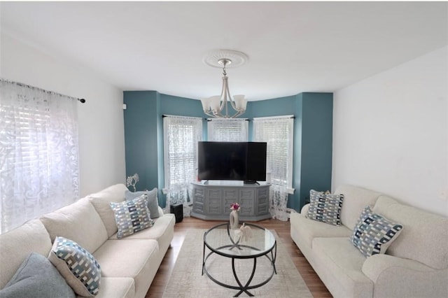 12 Hamilton St, Providence, RI 02907 - living room featuring a chandelier, healthy amount of natural light, and wood finished floors