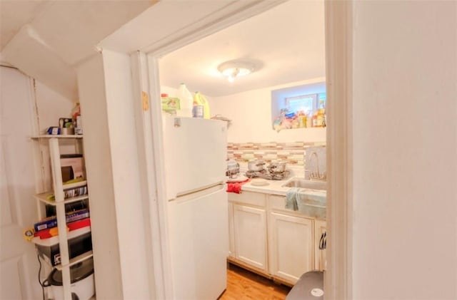 12 Hamilton St, Providence, RI 02907 - kitchen with freestanding refrigerator, a sink, light countertops, and light wood-type flooring