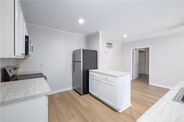 130 Hunts Ave, Pawtucket, RI 02861 - kitchen with stainless steel appliances, light wood-type flooring, white cabinetry, baseboards, and recessed lighting