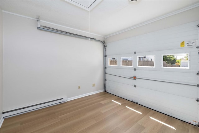 130 Hunts Ave, Pawtucket, RI 02861 - garage with baseboard heating and baseboards