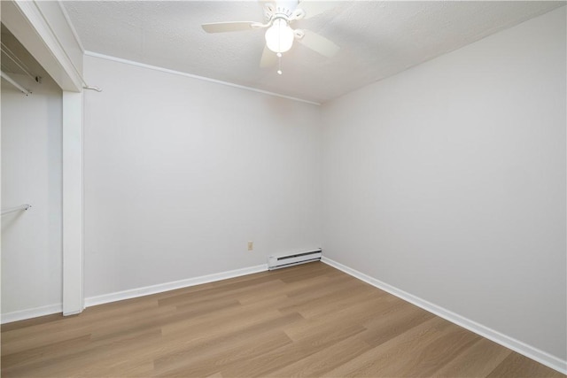 130 Hunts Ave, Pawtucket, RI 02861 - unfurnished room with light wood finished floors, baseboard heating, ceiling fan, baseboards, and a textured ceiling