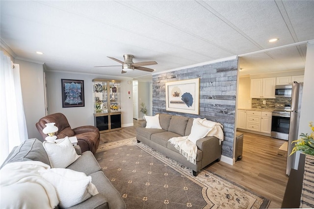 7 Lane D Dr, Coventry, RI 02816 - living room with ornamental molding, ceiling fan, recessed lighting, light wood-type flooring, and baseboards