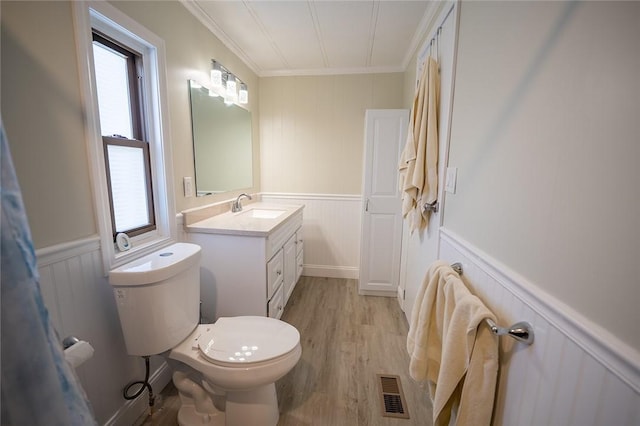 7 Lane D Dr, Coventry, RI 02816 - bathroom with a decorative wall, ornamental molding, vanity, toilet, and wood finished floors