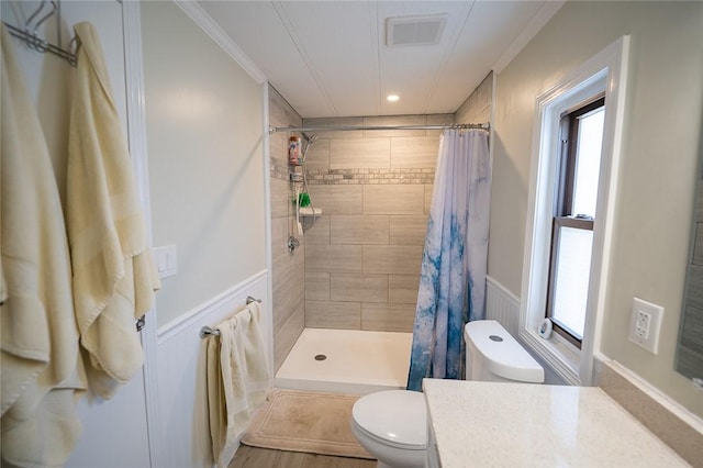 7 Lane D Dr, Coventry, RI 02816 - bathroom with toilet, vanity, tiled shower, crown molding, and wainscoting