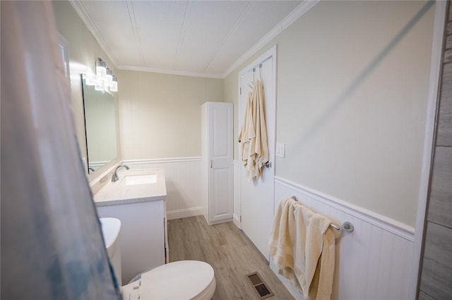 7 Lane D Dr, Coventry, RI 02816 - bathroom with wood finished floors, vanity, toilet, wainscoting, and crown molding