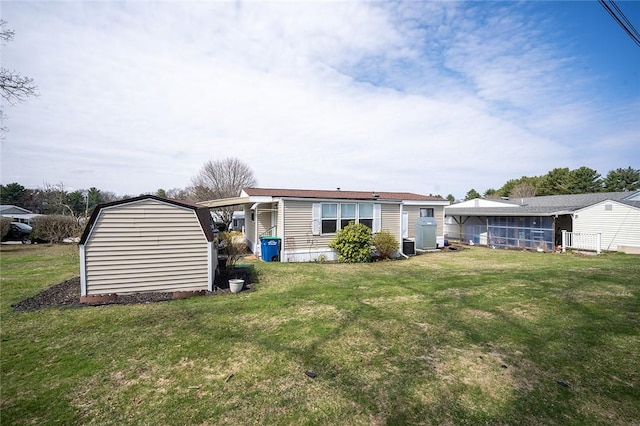 7 Lane D Dr, Coventry, RI 02816 - rear view of house featuring a lawn