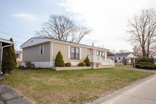7 Lane D Dr, Coventry, RI 02816 - manufactured / mobile home featuring a front lawn