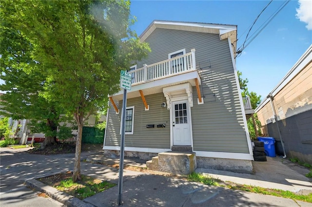 848 Dexter St, Central Falls, RI 02863 - view of front facade with a balcony and entry steps