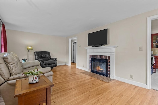 199 Vaughn Ave, Warwick, RI 02886 - living area with wood finished floors, a fireplace, and baseboards