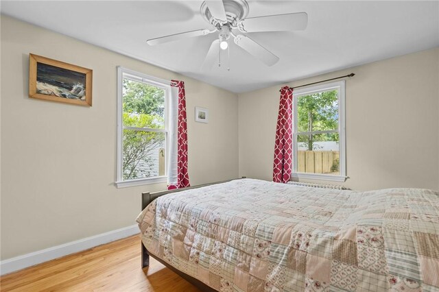 199 Vaughn Ave, Warwick, RI 02886 - bedroom with multiple windows, wood finished floors, baseboards, and ceiling fan