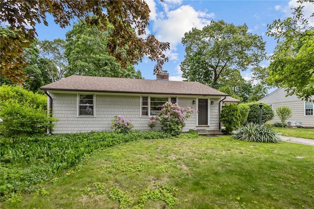 199 Vaughn Ave, Warwick, RI 02886 - ranch-style home featuring a chimney, a front lawn, and roof with shingles