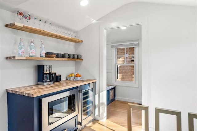 14 Robinson St, Narragansett, RI 02882 - indoor dry bar featuring beverage cooler, built in microwave, light wood-type flooring, vaulted ceiling, and recessed lighting