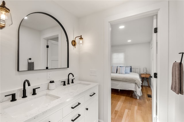 14 Robinson St, Narragansett, RI 02882 - full bathroom with double vanity, wood finished floors, and recessed lighting