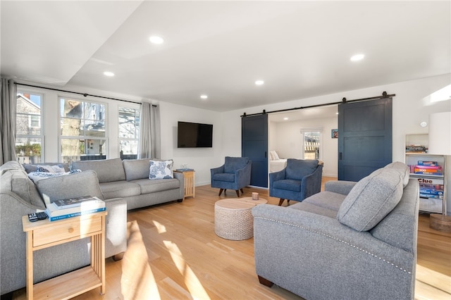 14 Robinson St, Narragansett, RI 02882 - living room featuring a barn door, plenty of natural light, light wood-type flooring, and recessed lighting
