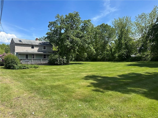 75 Croade St, Warren, RI 02885 - view of grassy yard featuring a deck