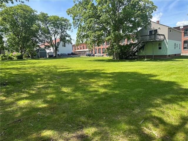 75 Croade St, Warren, RI 02885 - view of grassy yard featuring a deck and stairway