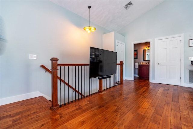 3976 Post Rd, Warwick, RI 02886 - living area featuring wood-type flooring, baseboards, and high vaulted ceiling