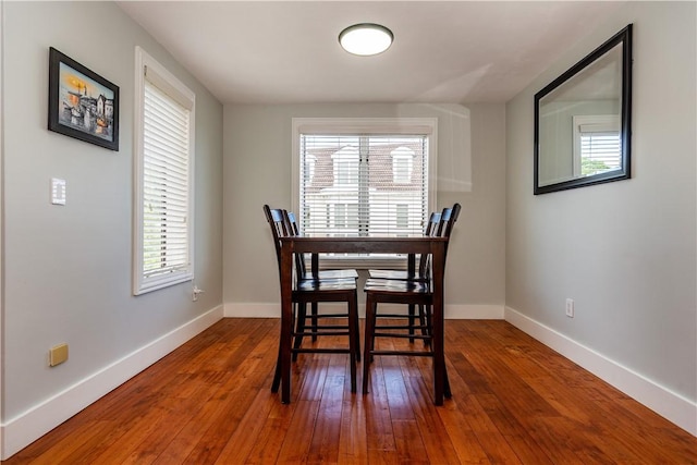 3976 Post Rd, Warwick, RI 02886 - dining room featuring healthy amount of natural light, baseboards, and hardwood / wood-style floors