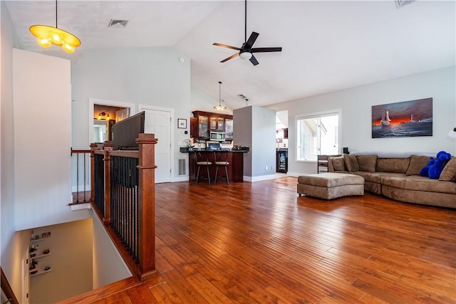3976 Post Rd, Warwick, RI 02886 - living room featuring wood-type flooring, ceiling fan, and high vaulted ceiling