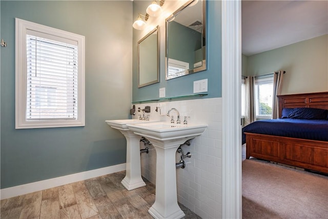 3976 Post Rd, Warwick, RI 02886 - ensuite bathroom with wood finished floors and baseboards