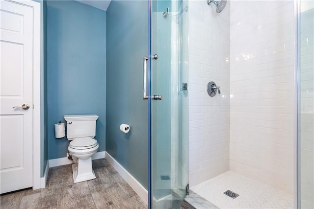 3976 Post Rd, Warwick, RI 02886 - bathroom with a stall shower, toilet, baseboards, and wood finished floors