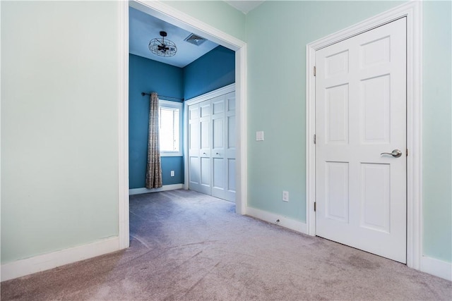 3976 Post Rd, Warwick, RI 02886 - unfurnished bedroom with carpet floors, baseboards, and a closet