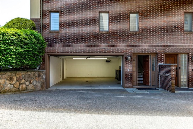 3976 Post Rd, Warwick, RI 02886 - garage featuring asphalt driveway
