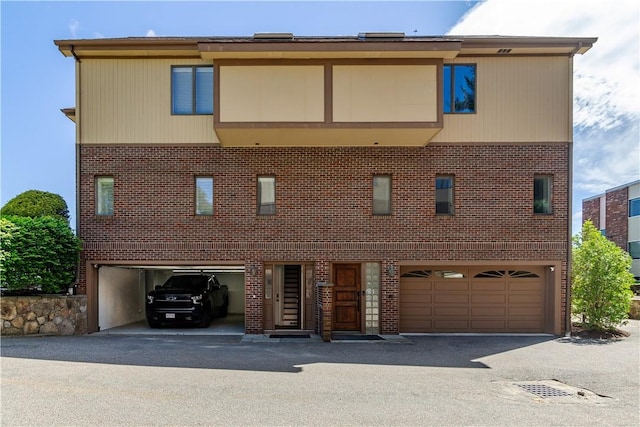 3976 Post Rd, Warwick, RI 02886 - townhome / multi-family property with an attached garage and brick siding