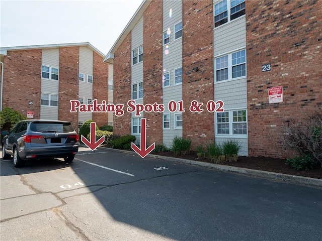 23 Bullocks Point Ave Unit 2/4C, East Providence, RI 02915 - view of building exterior featuring uncovered parking