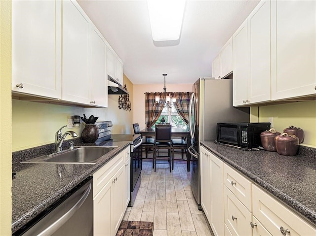 23 Bullocks Point Ave Unit 2/4C, East Providence, RI 02915 - kitchen featuring appliances with stainless steel finishes, a sink, under cabinet range hood, and white cabinets