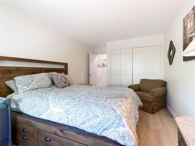 23 Bullocks Point Ave Unit 2/4C, East Providence, RI 02915 - bedroom with light wood-type flooring, a closet, and baseboards