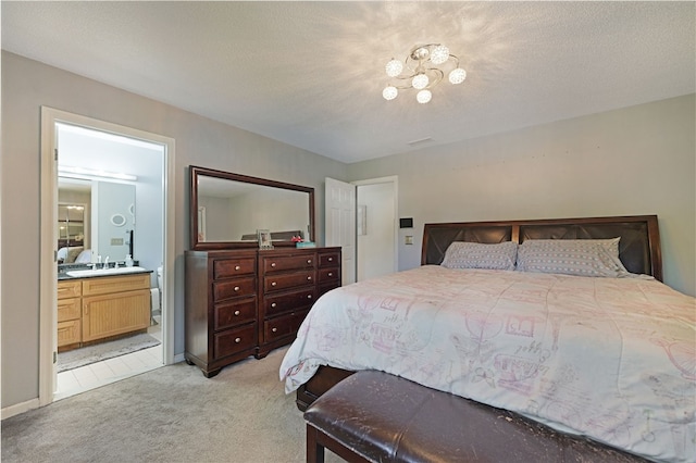 29 Valley View Dr, Cranston, RI 02921 - bedroom featuring light carpet, ensuite bathroom, and a sink