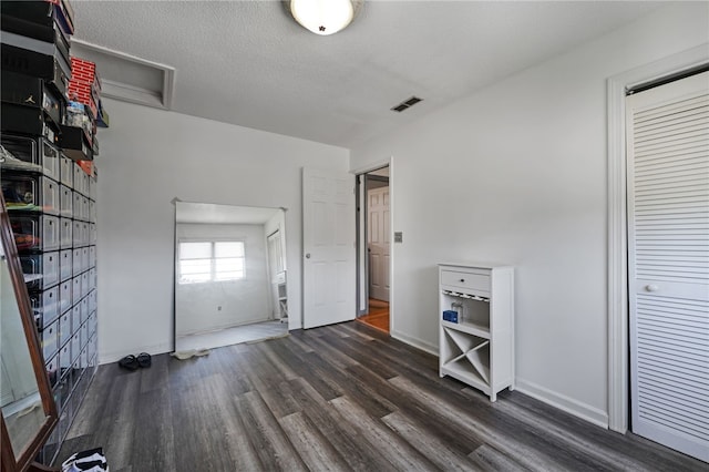 29 Valley View Dr, Cranston, RI 02921 - unfurnished bedroom with dark wood-style floors, baseboards, and a textured ceiling