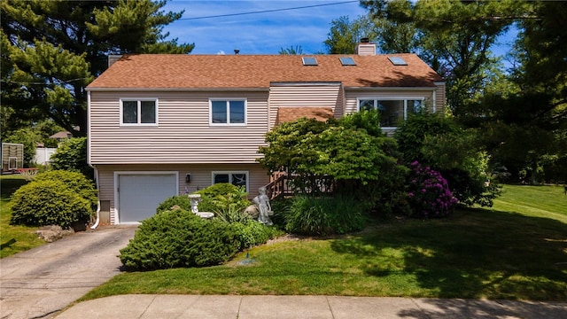 29 Valley View Dr, Cranston, RI 02921 - view of front of property featuring a front yard, a chimney, an attached garage, and driveway