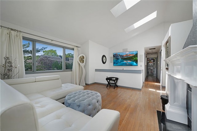 29 Valley View Dr, Cranston, RI 02921 - living area featuring a skylight, light wood-style flooring, and high vaulted ceiling