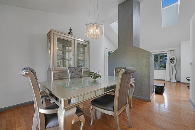 29 Valley View Dr, Cranston, RI 02921 - dining room with a chandelier, wood finished floors, baseboards, and a high ceiling