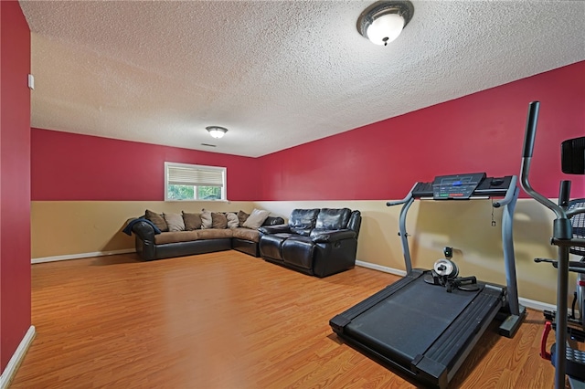 29 Valley View Dr, Cranston, RI 02921 - workout room featuring wood finished floors, a textured ceiling, and baseboards