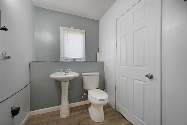 29 Valley View Dr, Cranston, RI 02921 - bathroom with toilet, wood finished floors, and baseboards
