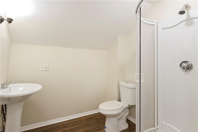 9 Woodbine St, Providence, RI 02906 - bathroom with wood finished floors, a shower, a sink, toilet, and baseboards