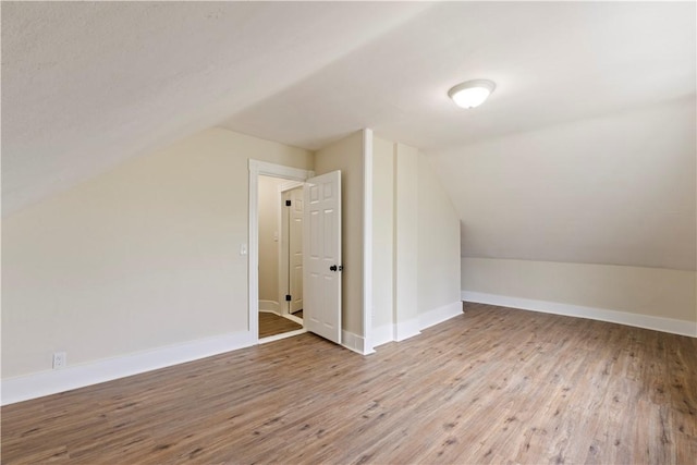 9 Woodbine St, Providence, RI 02906 - bonus room with vaulted ceiling, wood-type flooring, and baseboards