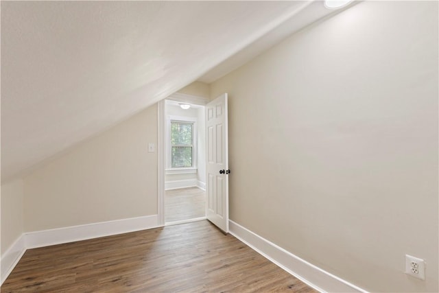 9 Woodbine St, Providence, RI 02906 - additional living space with lofted ceiling, wood finished floors, and baseboards