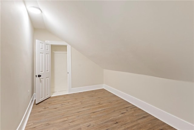 9 Woodbine St, Providence, RI 02906 - additional living space featuring vaulted ceiling, light wood-style flooring, and baseboards