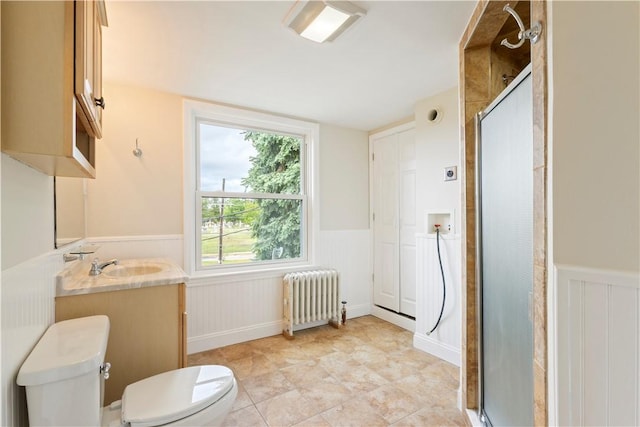9 Woodbine St, Providence, RI 02906 - full bathroom with radiator heating unit, toilet, a wainscoted wall, a shower stall, and vanity