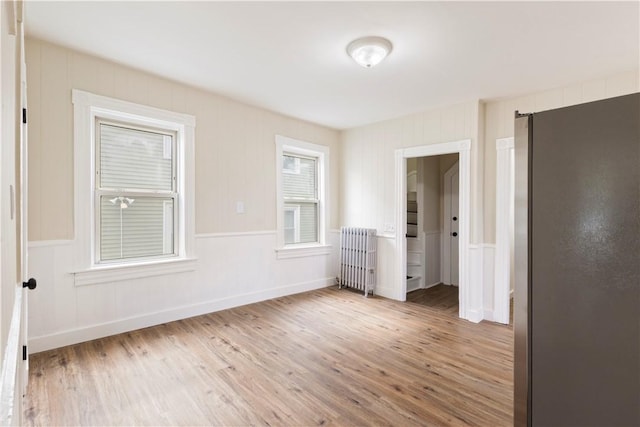 9 Woodbine St, Providence, RI 02906 - unfurnished bedroom featuring radiator heating unit and wood finished floors