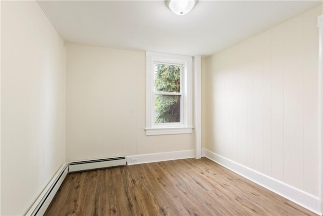 9 Woodbine St, Providence, RI 02906 - unfurnished room with wood finished floors, baseboard heating, and baseboards