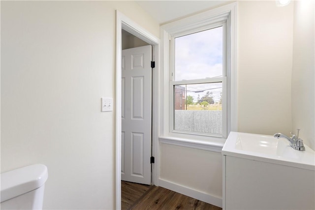 9 Woodbine St, Providence, RI 02906 - washroom with dark wood-style floors, baseboards, and a sink