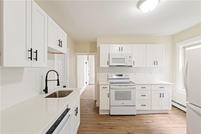 9 Woodbine St, Providence, RI 02906 - kitchen with white appliances, a sink, a baseboard radiator, white cabinetry, and light countertops