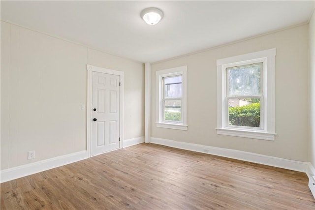 9 Woodbine St, Providence, RI 02906 - empty room featuring wood finished floors and baseboards