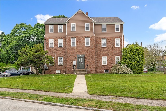 165 Wentworth Ave Unit 2E, Cranston, RI 02905 - view of front of property with a front yard, a chimney, and brick siding