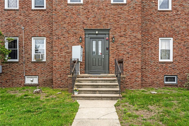 165 Wentworth Ave Unit 2E, Cranston, RI 02905 - property entrance with brick siding and a lawn